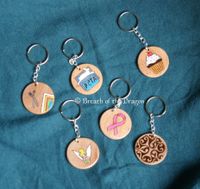 wooden keychains with pyrography and watercolors