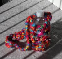 rainbow colored bottle carrier with long strap, crochet by Sunfire