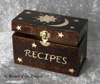 recipe card box burned dark with celestial bodies and word ‘recipes’ left as natural wood, pyrography by Sunfire