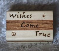 small multi-color wood box featuring “Wishes Come True” and various symbols, pyrography by Sunfire