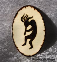 oval kokopelli magnet, pyrography by Sunfire