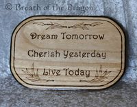 rounded rectangle plaque burned with text ‘Dream Tomorrow - Cherish Yesterday - Live Today’, pyrography by Sunfire